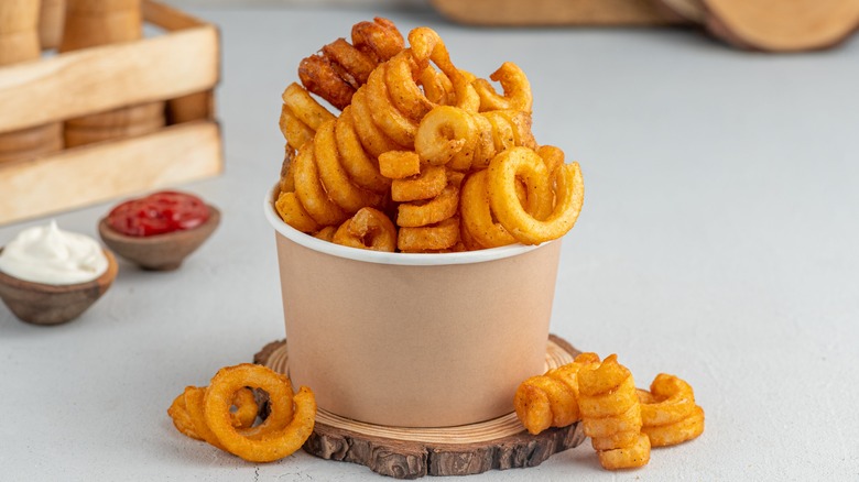 A container of curly fries