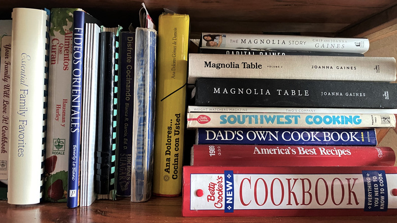 A collection of cookbooks stacked together