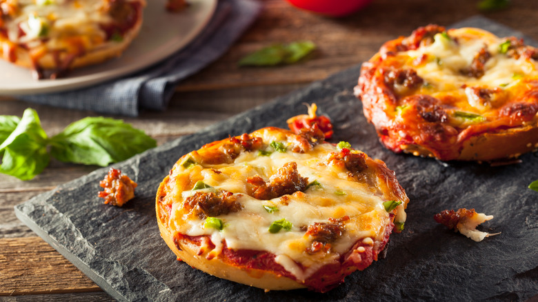 Pizza bagels on grey slate