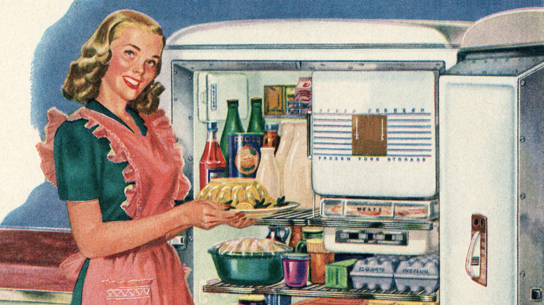 Vintage color add of woman holding Jell-o in front of fridge