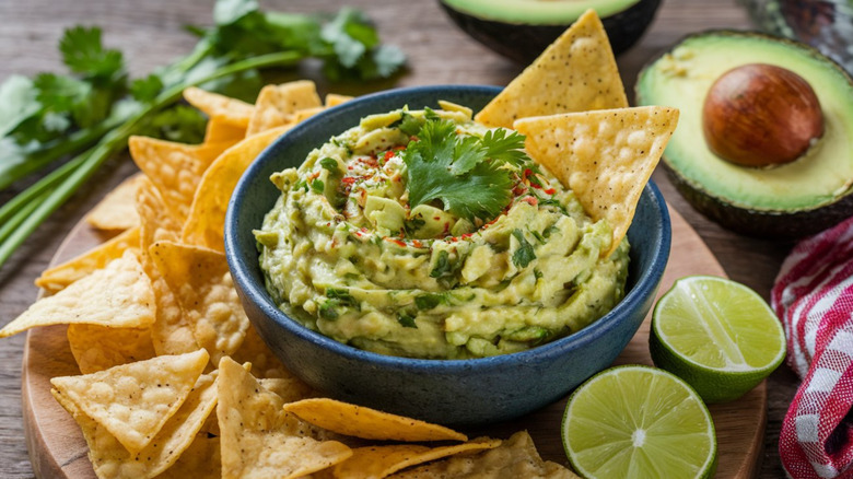 Crispy tortilla chips and heaping bowl of guacamole