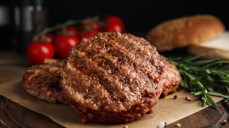 A burger with meat patty and sauces