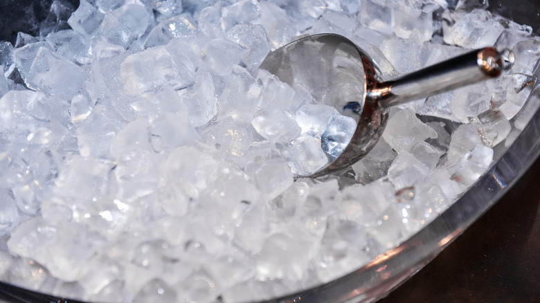 Nugget ice inside of ice tray with metal scoop