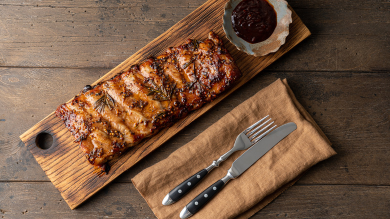 Rack of ribs on a wooden serving board