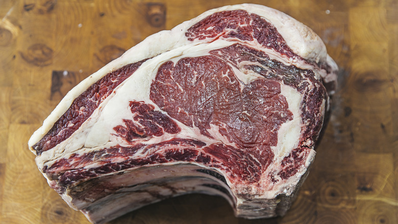 A raw prime rib steak