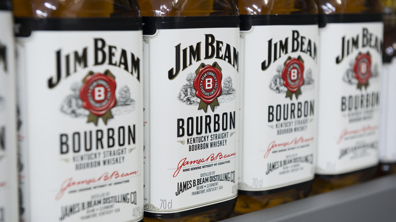 A row of Jim Beam bourbon bottles