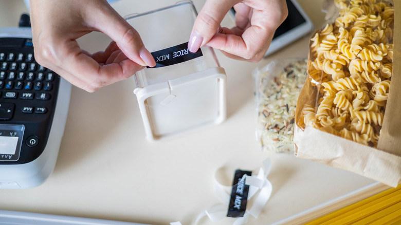 hands using label maker