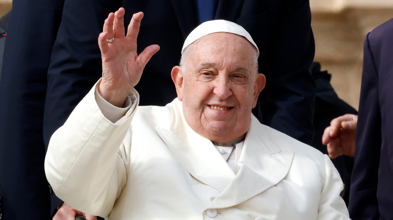 Pope Francis waving to a crowd