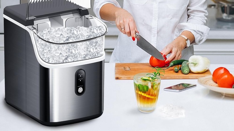 Person preparing food next to a Joy Pebble ice maker