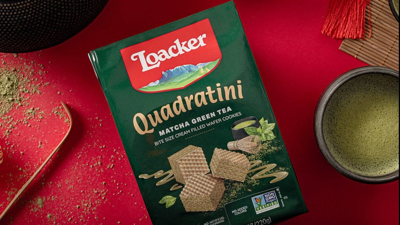 Bag of Loacker Quadratini Matcha Green Tea wafers on red surface