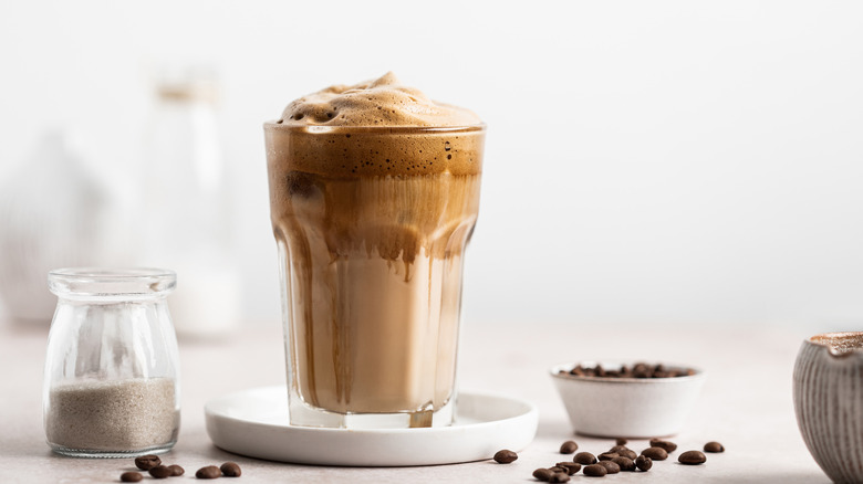 chocolate cold foam on top of coffee in glass