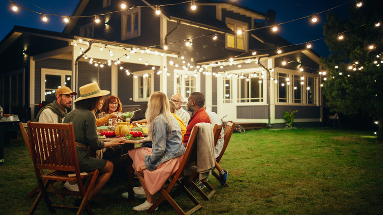people enjoying a grilled meal