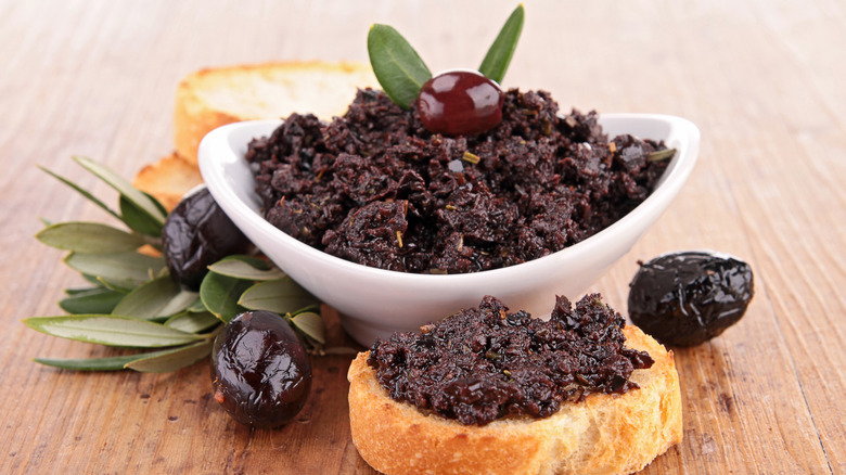 Olive tapenade with piece of bread