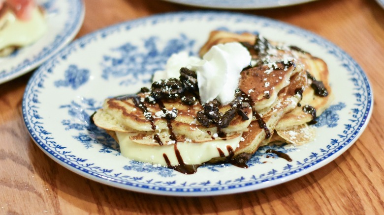A blue and white plate of Oreo stuffed pancakes
