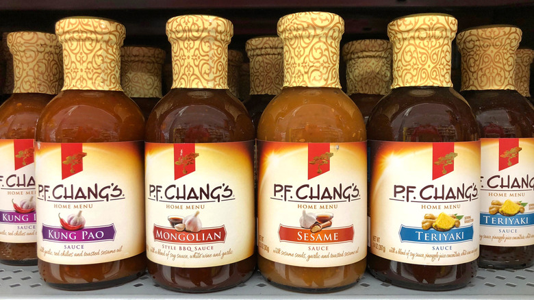 Bottles of P.F. Chang's sauces on a shelf at a grocery store