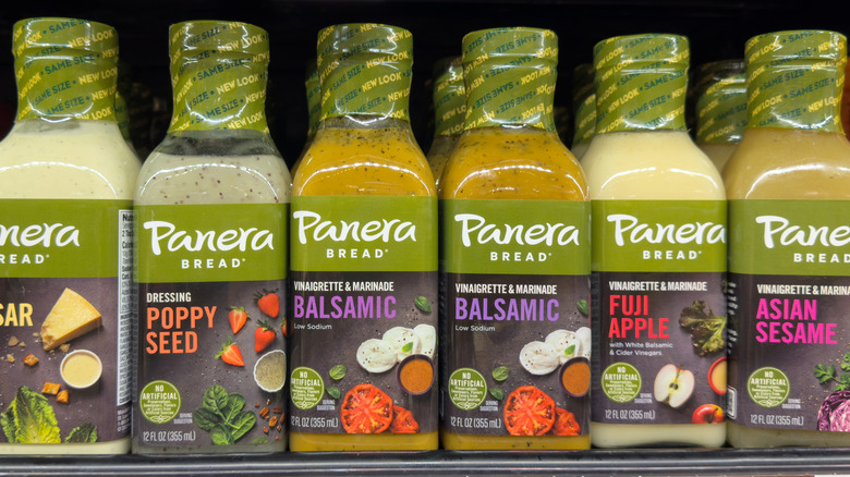 Bottles of Panera salad dressing ona  shelf in a grocery store