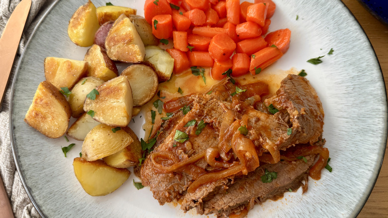 Dinner plate with brisket, carrots, and potatoes