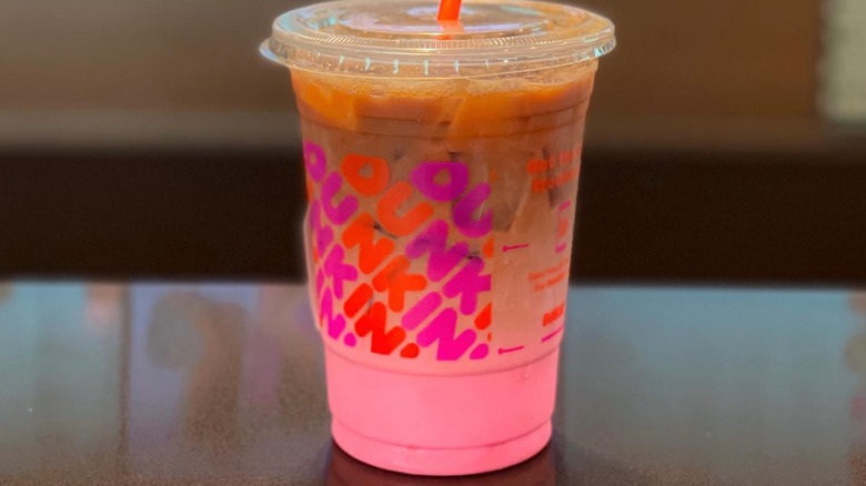 A Pink Velvet Macchiato sitting on a table