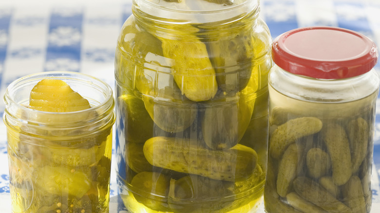 Jars of pickles on table