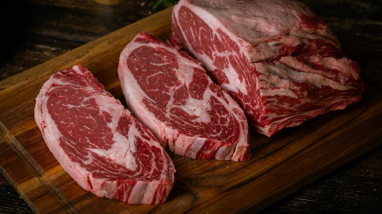 ribeye on wood cutting board