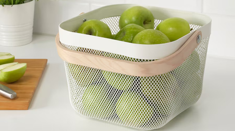 Basket holding apples