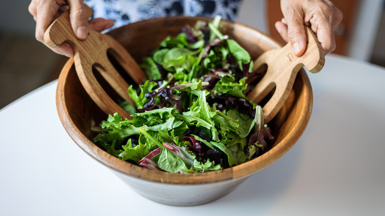 Green salad in a wooden bowl