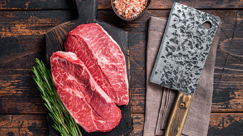 Two shoulder steaks on board
