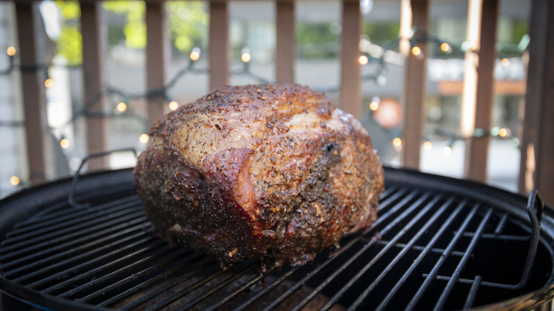 large pork roast on barbecue