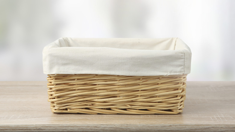 small empty basket sitting on wooden surface