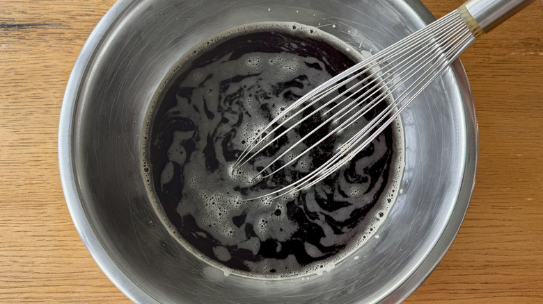 Whisking coffee granita ingredients in bowl