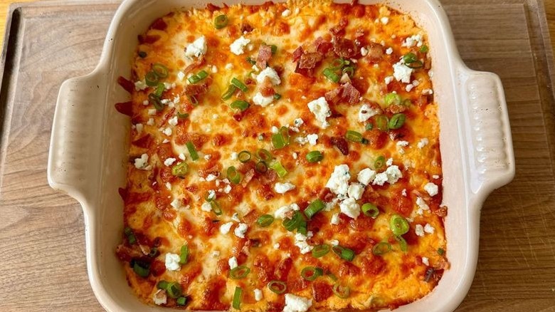 Buffalo chicken dip with garnishes
