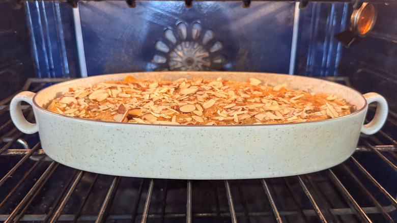 Gluten-free peach cobbler baking in oven
