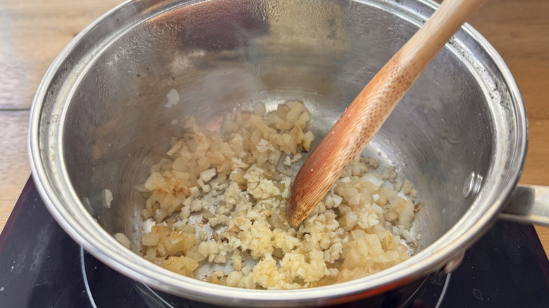 oil, onions, and garlic in a metal pot