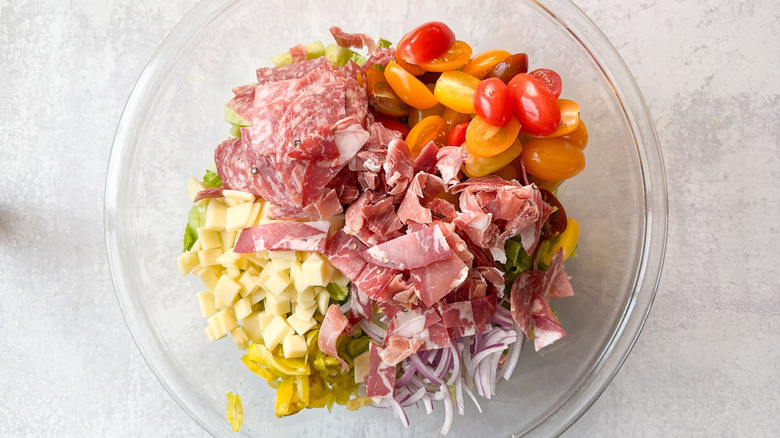 Italian deli grinder salad ingredients in glass bowl