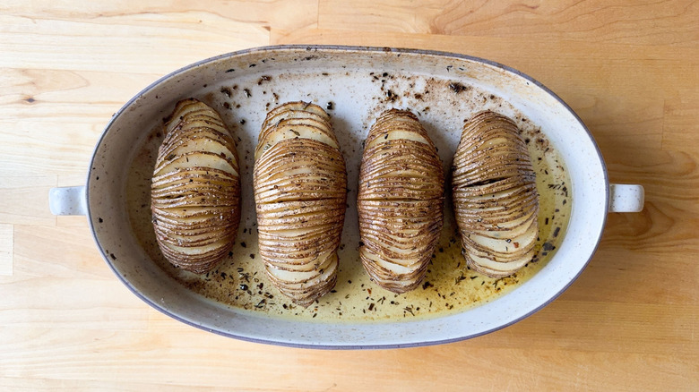 Baked Hasselback potatoes in casserole dish