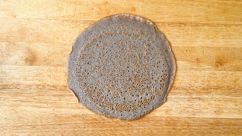 Buckwheat crepe on cutting board