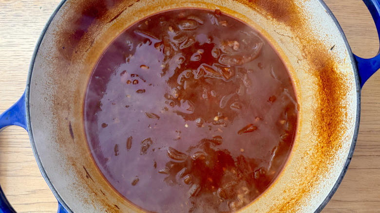 Reduced brisket sauce in Dutch oven
