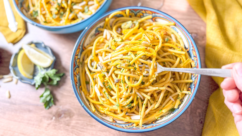 High-protein pasta con le sarde (with sardines) in serving bowl with fork