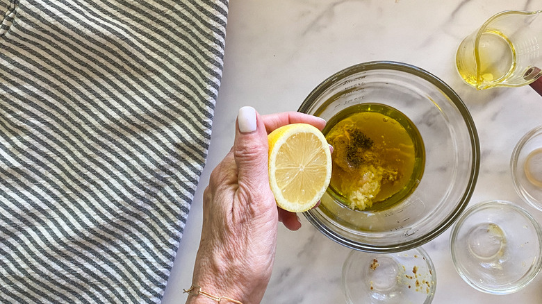 adding lemon to bowl