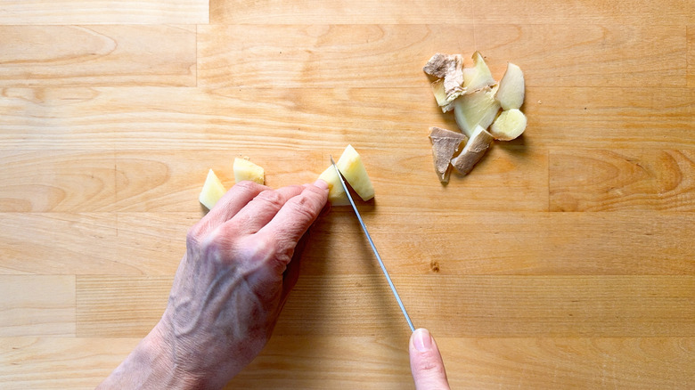 Peeling and cutting fresh ginger root