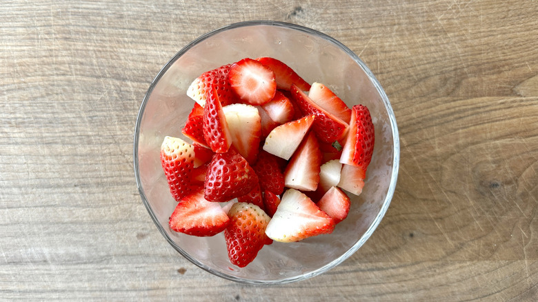 chopped strawberries in clear bowl