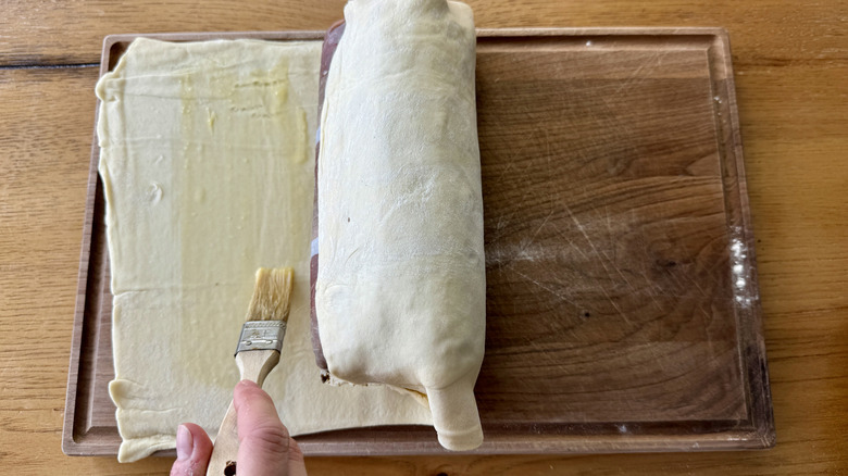 wrapping tenderloin with puff pastry