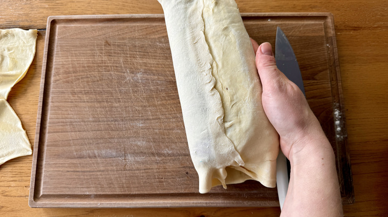 pinching puff pastry seam wrapped around tenderloin