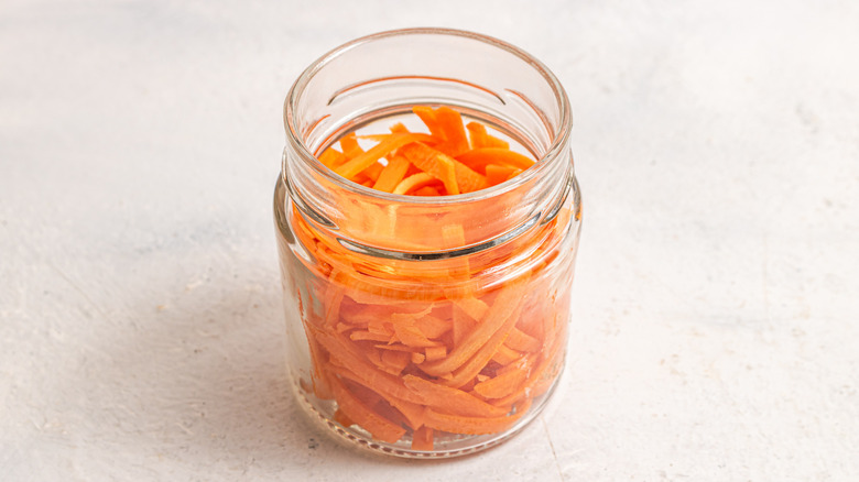 Jar with stripes of carrot