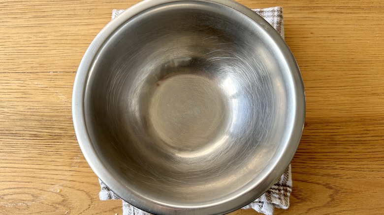 Damp towel under bowl
