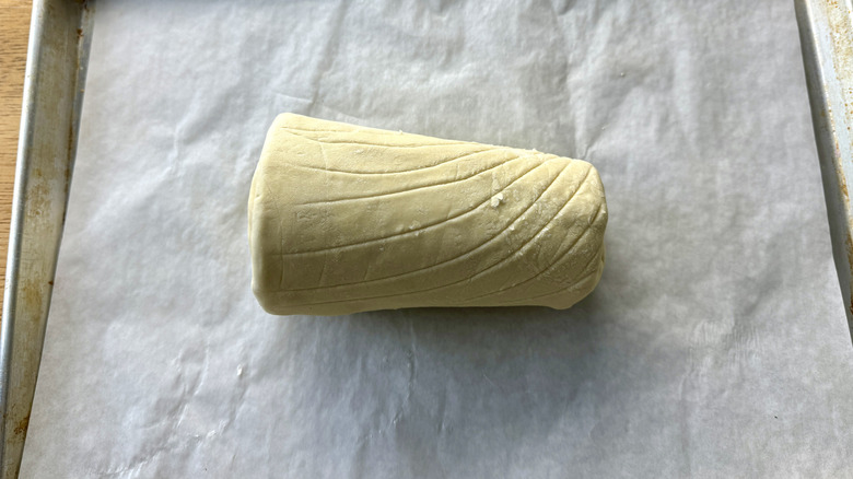 puff pastry wrapped tenderloin on baking sheet
