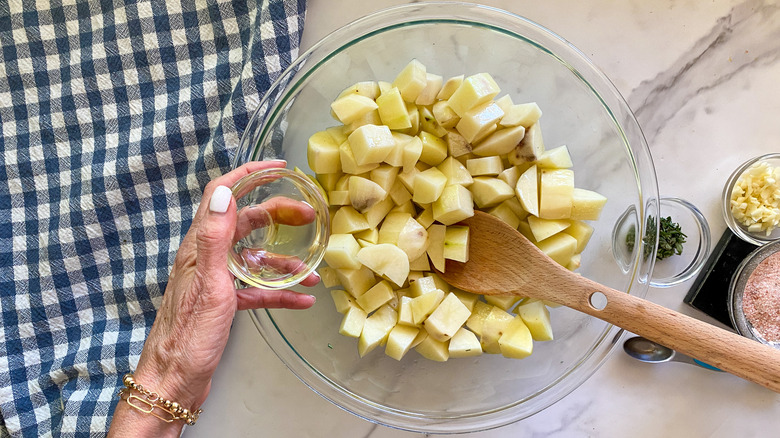 adding oil to bowl