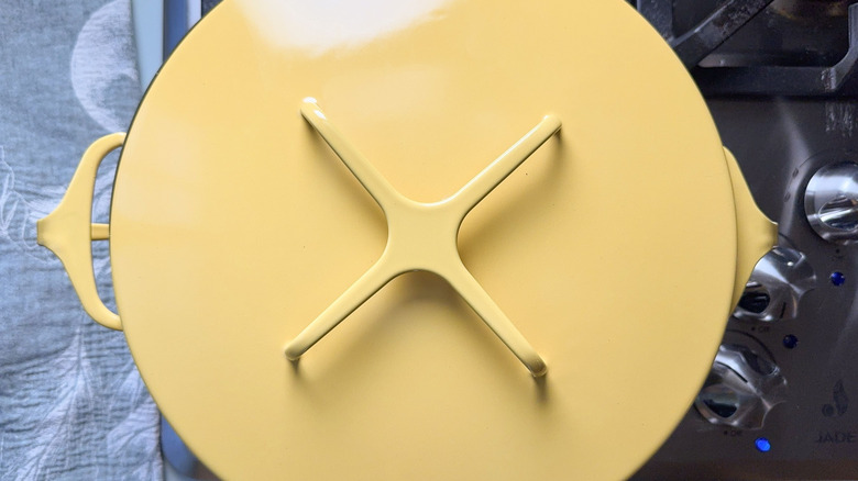Yellow covered pot on stovetop