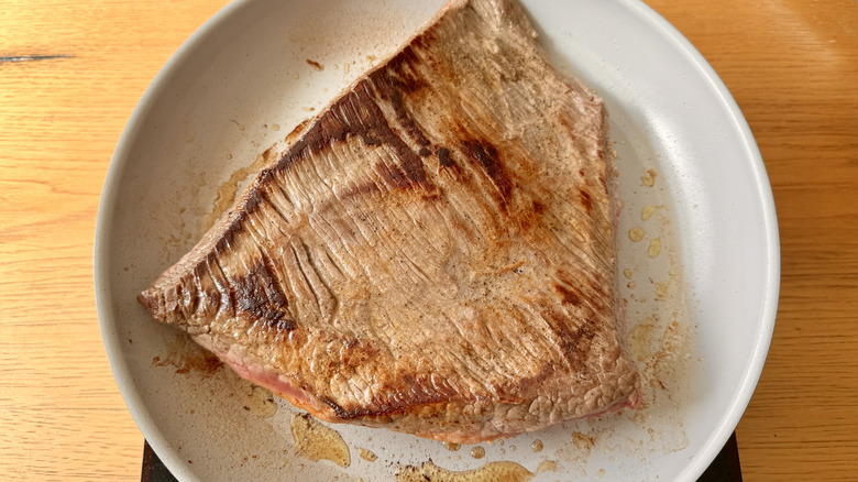 Brisket searing in skillet