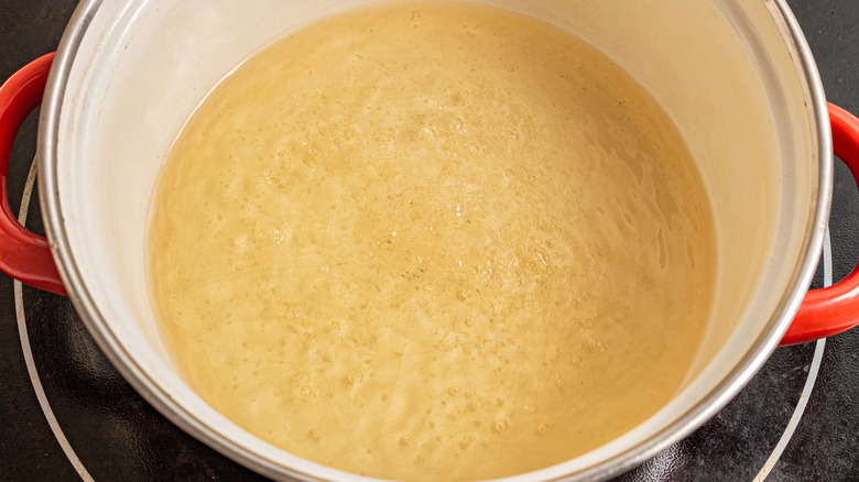Saucepan with boiling liquid in it